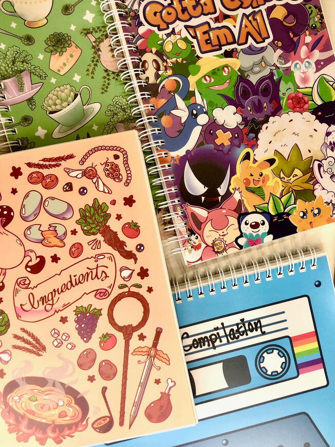 Assorted StickerBooks Image of a collection of sticker books all sitting together on a table.